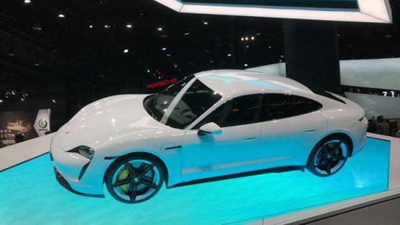Porsche Taycan at the Frankfurt motor show 2019 - front side view on blue plinth