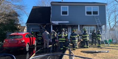Central Islip firefighters extinguished the flames at the house on Oak Street.
