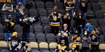 PITTSBURGH, PA - MARCH 02: Social distant fans cheer during the first period in the NHL game between the Pittsburgh Penguins and the Philadelphia Flyers on March 2, 2021, at PPG Paints Arena in Pittsburgh, PA. (Photo by Jeanine Leech/Icon Sportswire via Getty Images)