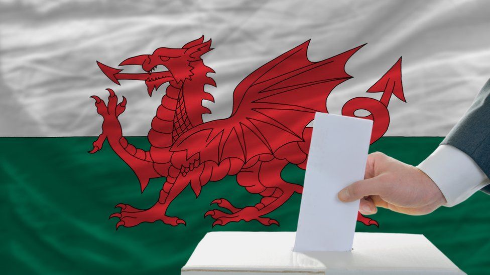 Ballot box with Wales flag behind