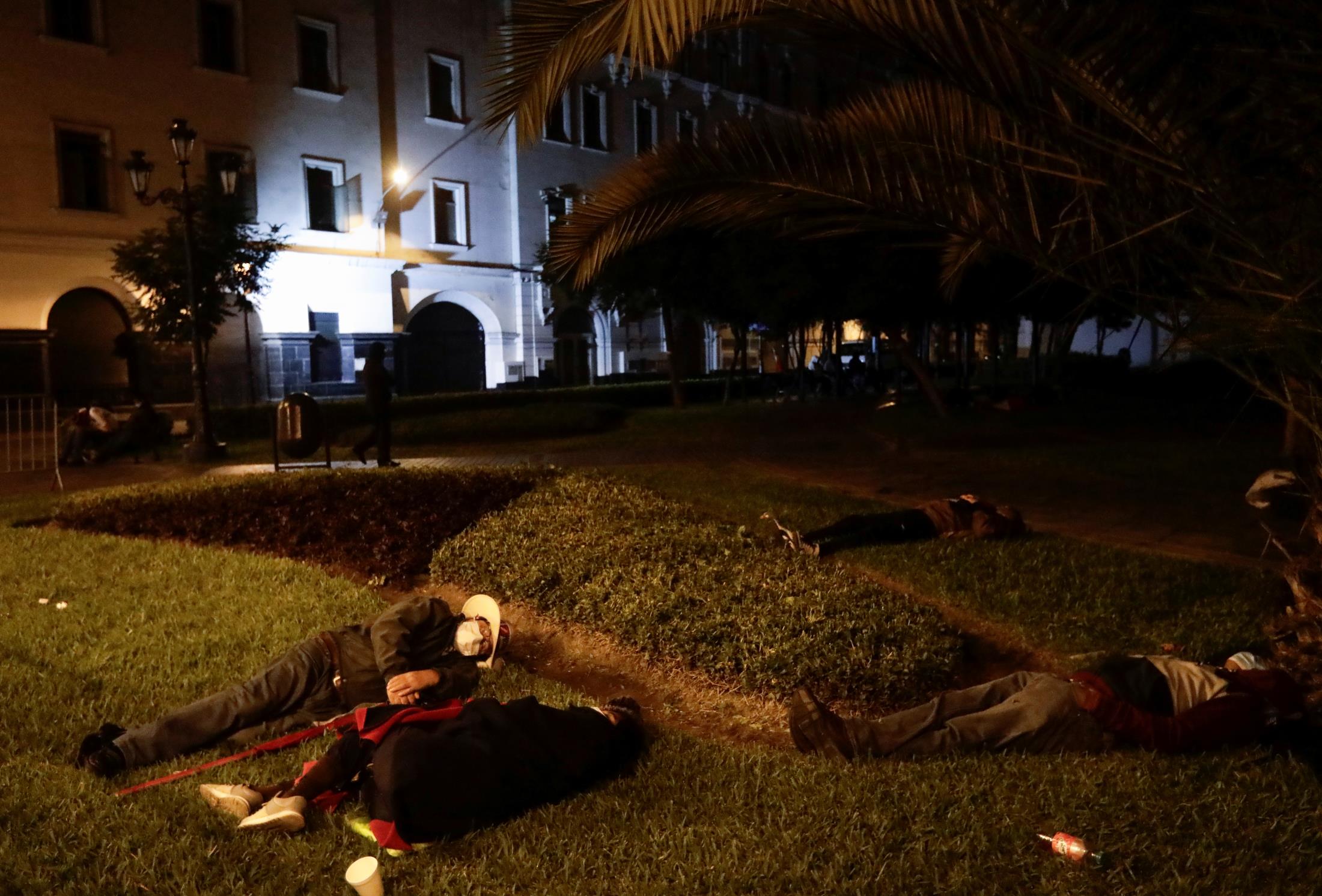 Supporters of Peru's presidential candidate Pedro Castillo sleep across the street from the Natio<em></em>nal Jury of Elections, in Lima, Peru June 10, 2021. REUTERS/Angela Ponce