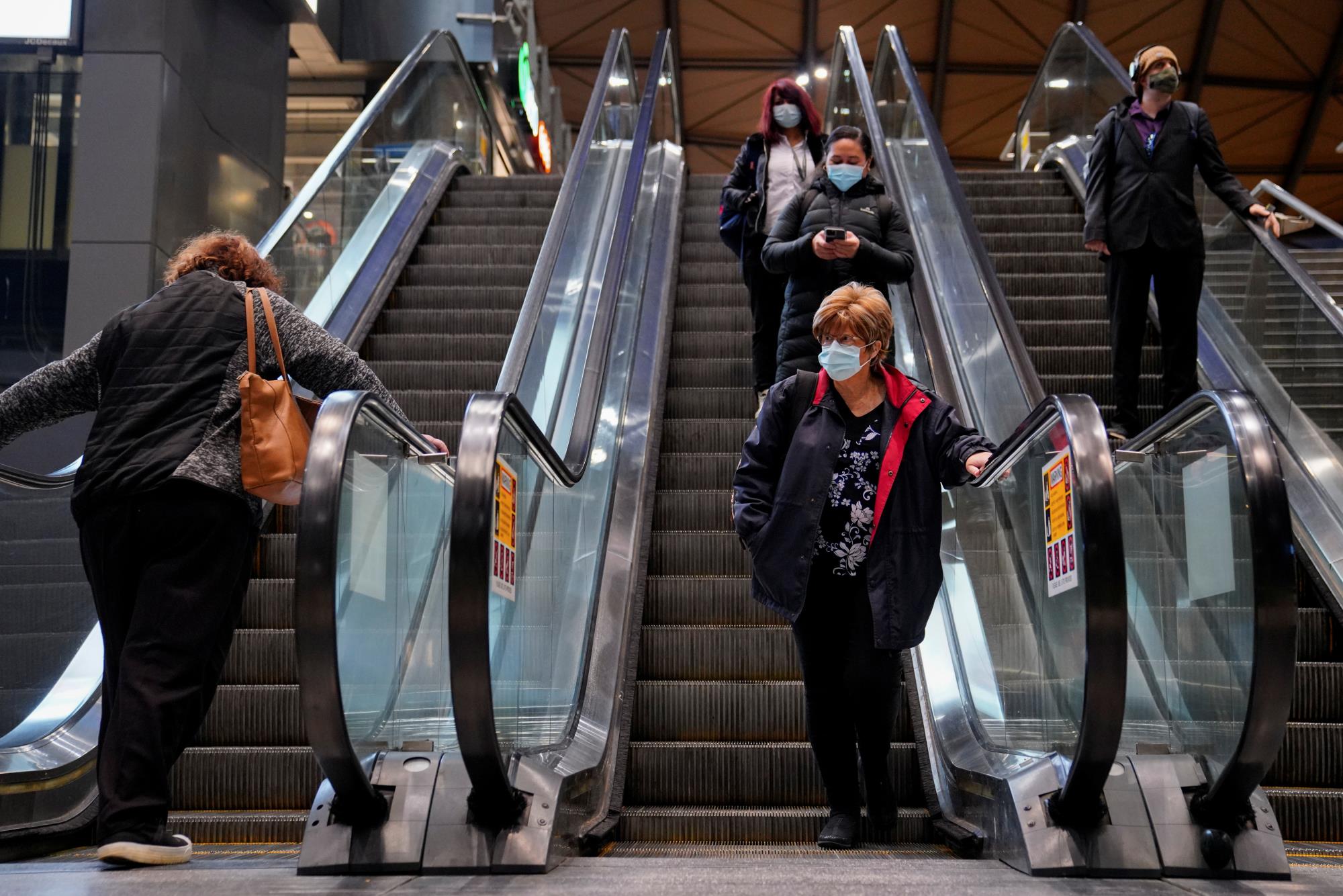 Morning commuters exit Southern Cross Station on the first day of eased coro<em></em>navirus disease (COVID-19) restrictions for the state of Victoria following an extended lockdown in Melbourne, Australia, June 11, 2021.  REUTERS/Sandra Sanders