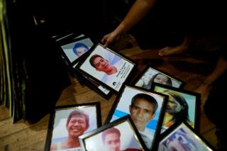 f<em></em>ramed portraits of Philippines' drug war victims are prepared for the theatre performance of grieving families on their journey of loss and healing in a Catholic school in Makati City, Philippines, March 4, 2020. REUTERS/Eloisa Lopez