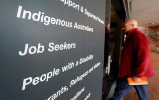A man walks into a Centrel<em></em>ink, part of the Australian government's department of human services wher<em></em>e job seekers search for employment, in a Sydney suburb, August 7, 2014. REUTERS/Jason Reed/File Photo