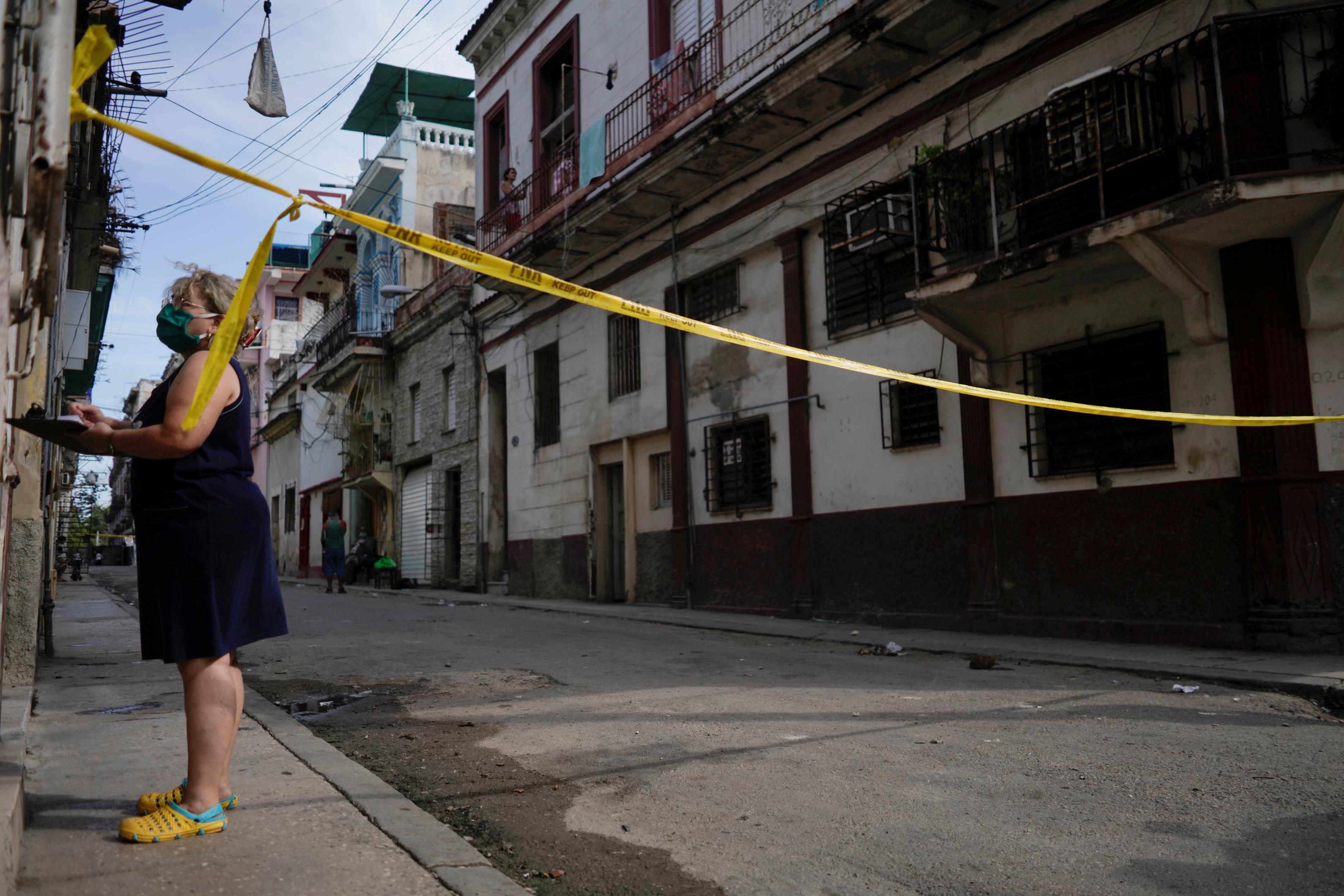 A health worker asks questions in a quarantine area amid co<em></em>ncerns a<em></em>bout the spread of the coro<em></em>navirus disease (COVID-19) in Havana, Cuba, April 8, 2021. Picture taken April 8, 2021. REUTERS/Alexandre Meneghini