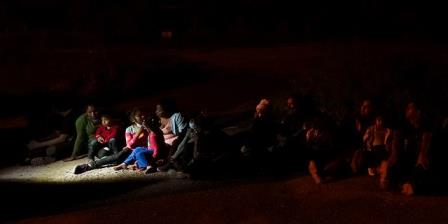 Migrants mainly from Ho<em></em>nduras and Nicaragua sit in line after turning themselves in upon crossing the U.S.-Mexico border Monday, May 17, 2021, in La Joya, Texas. (Associated Press)