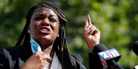 FILE - In this Aug. 5, 2020, file photo, then-activist Cori Bush speaks during a news co<em></em>nference Wednesday, Aug. 5, 2020, in St. Louis. Bush was elected to Co<em></em>ngress in November and is a member of the progressive Squad. (AP Photo/Jeff Roberson, File)