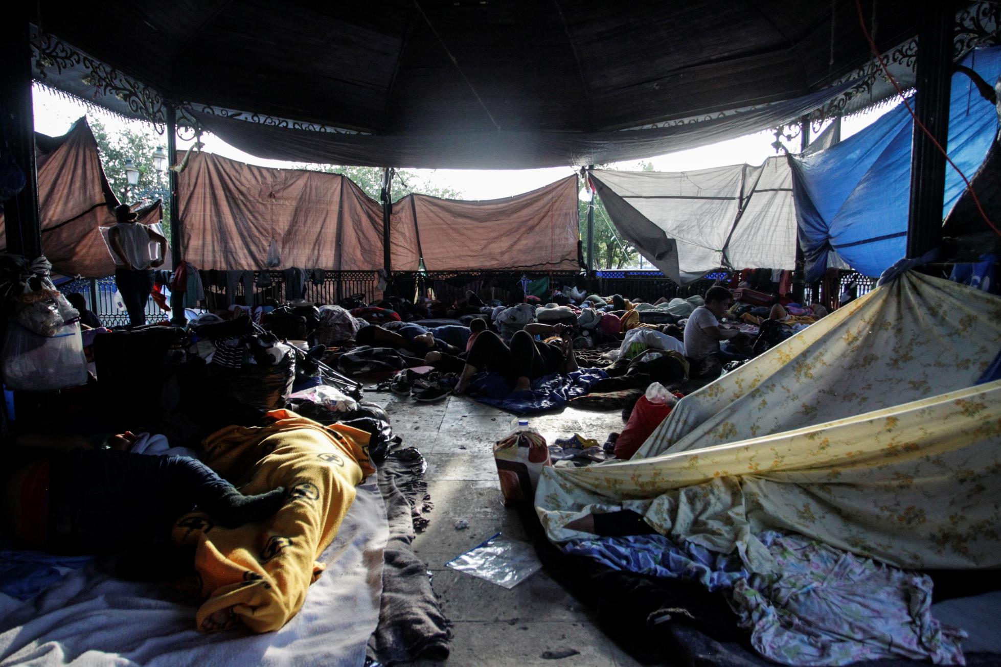 Asylum-seeking migrants, who were apprehended and returned to Mexico under Title 42 after crossing the border from Mexico into the U.S., rest in a public square wher<em></em>e hundreds of migrants live in tents, in Reynosa, Mexico June 10, 2021. Picture taken June 10, 2021. REUTERS/Daniel Becerril