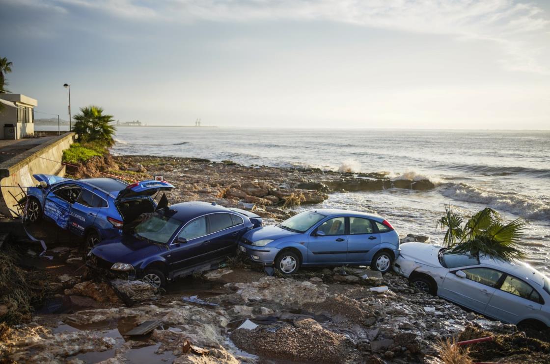 Wrecked cars stuck in the shore of the seaside town of Alcanar, in northeastern Spain, Sept. 2, 2021. (AP Photo)