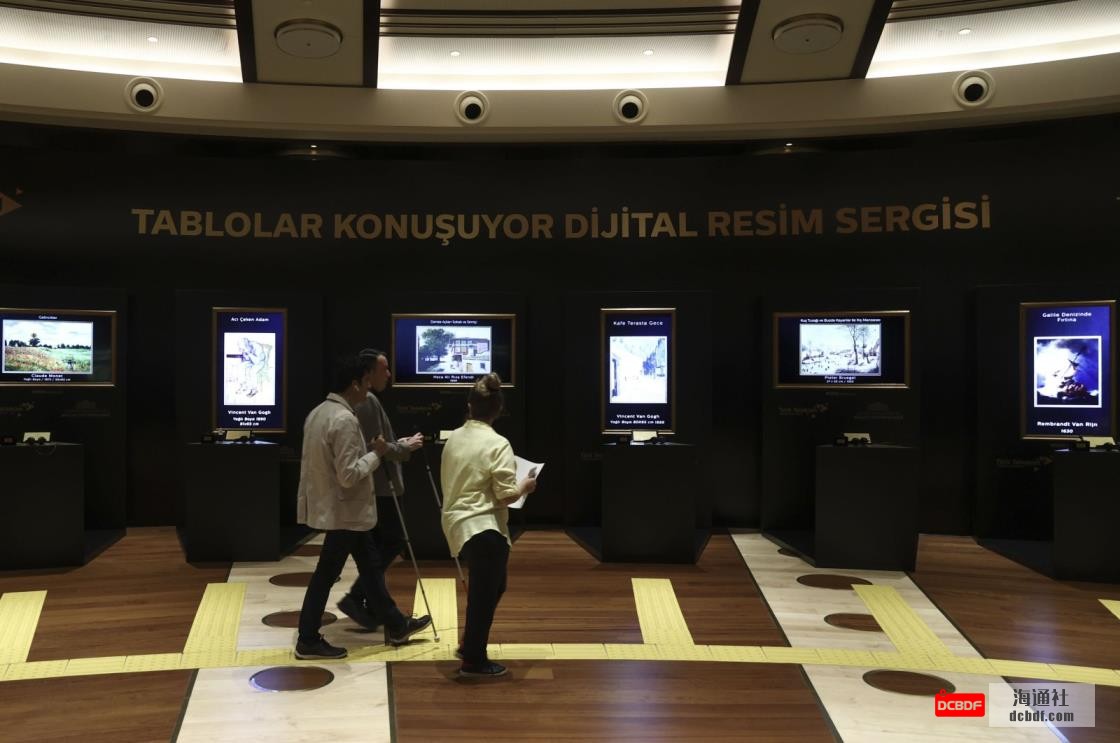 People visit the “Paintings Talk Digital Art Exhibition” at the Presidential Library within the scope of the 10th anniversary of Türk Telekom’s “Telephone Library” project that allows visually impaired people to access information and meet with art, Ankara, Turkey, July 30, 2021. (AA Photo)