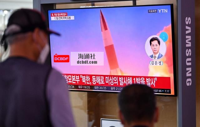 People watch a TV news broadcast showing file footage of a North Korean missile test, at a railway station in Seoul on Tuesday. | AFP-JIJI
