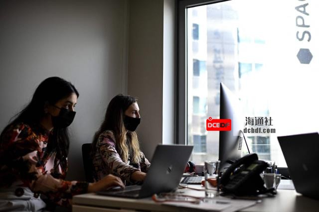 Two women work at a co-working office in Paris in October last year. | AFP-JIJI