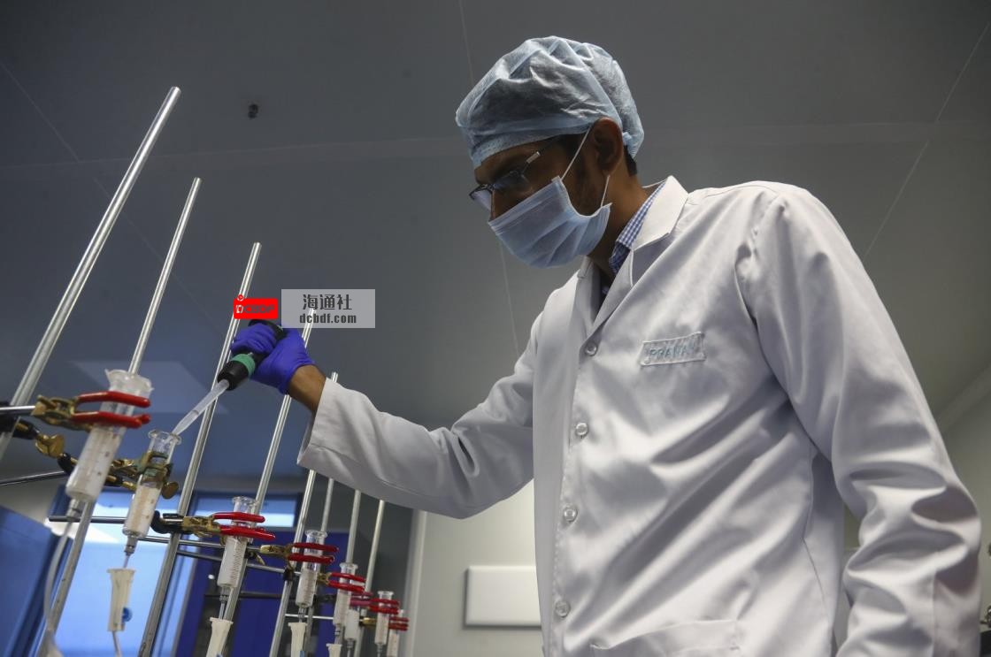 A scientist works at a lab of Huwel Lifesciences that manufactures COVID-19 test kits in Hyderabad, India on Oct. 7, 2021. (AP Photo)