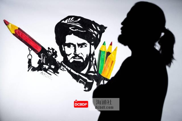 Farshad, artist and co-founder of the ArtLords collective, poses next to a drawing representing a Taliban fighter whose rocket launcher is filled with pencils. | AFP-JIJI
