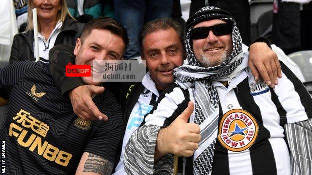 Newcastle fans celebrate the club's new era under new owners