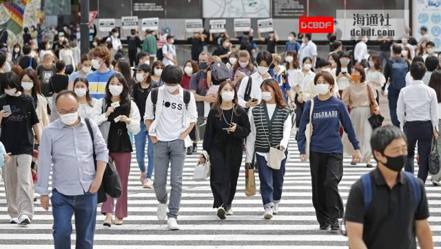 People walk on a crossing near Tokyo's Shibuya Station on Tuesday. | KYODO